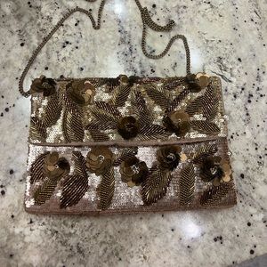 Beautiful bronze clutch bag with floral embellishments